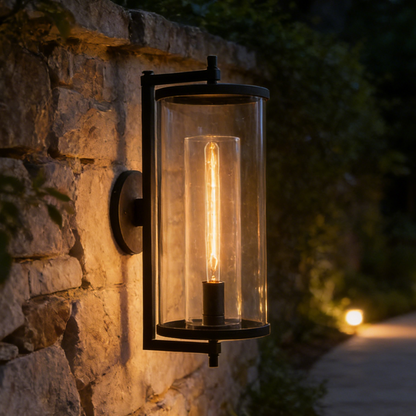Outdoor wall light fixture on a stone wall with a warm glow